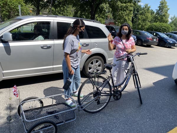 Women sharing bike through BikeMatch program